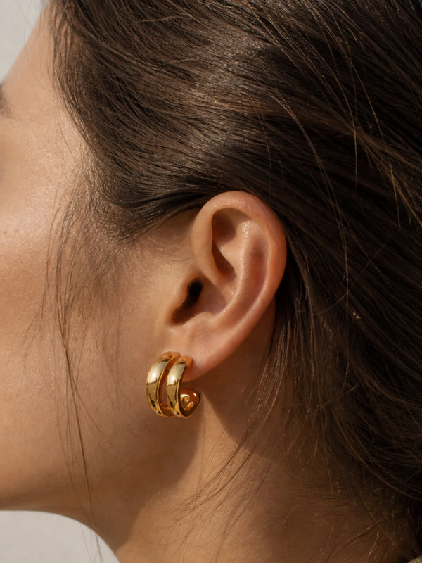 Model wearing Daily Hoop Bold gold hoop earrings