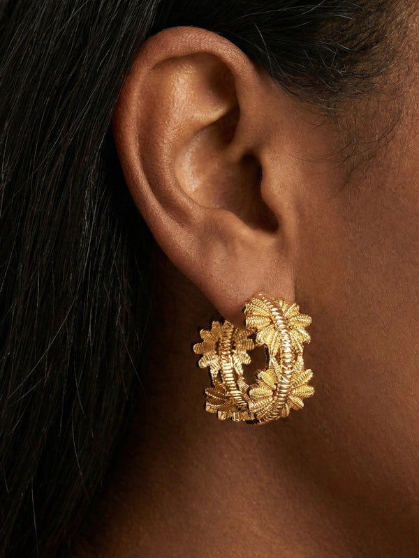 Model wearing Daily Hoop Flora gold hoop earrings