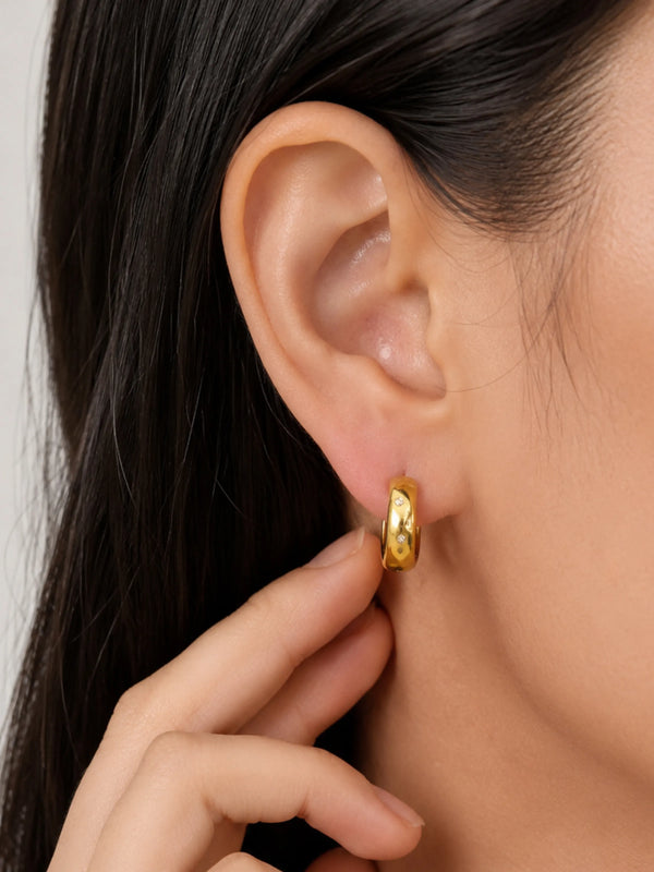 Model wearing Daily Hoop Spark gold hoop earrings